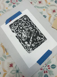 a black and white drawing on a piece of paper